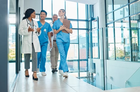 Group of physicians walking.